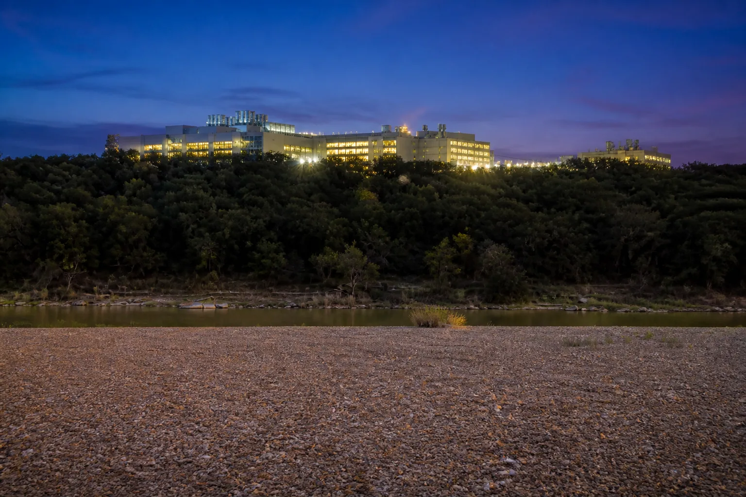 Brazos gravel bar with a hyperscale campus on the opposite shore